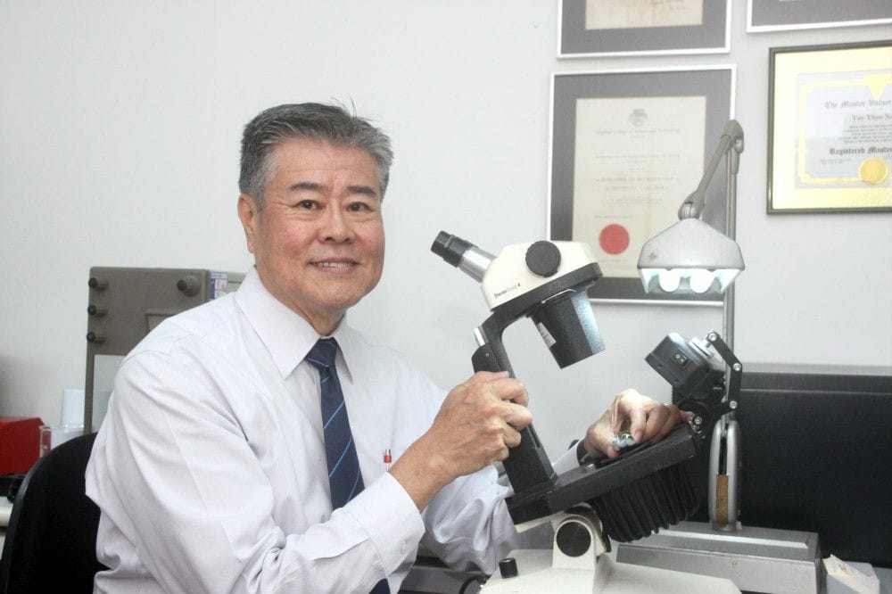 Mr Tay Thye Sun, gemologist, verifying a stone's authenticity at Far East Gem Lab.